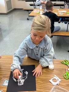 student doing art